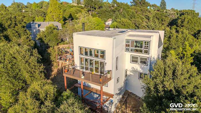 Modern home exterior in Orinda featuring James Hardie Arctic White siding, custom trim, and large Anlin windows