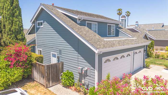 Foster City home featuring James Hardie Lap Siding in Boothbay Blue with Arctic White trim and landscaped yard