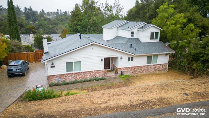 Modern home exterior featuring James Hardie Cedarmill siding, Alside windows, and a landscaped front yard in Oakland, CA
