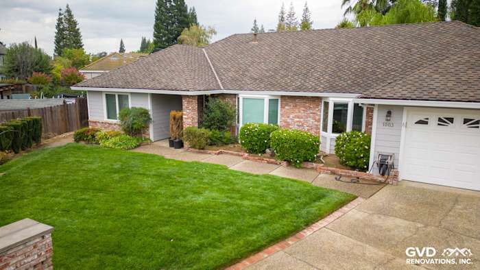 Updated Roseville home exterior featuring James Hardie Cedarmill siding, new Milgard windows, and green landscaping