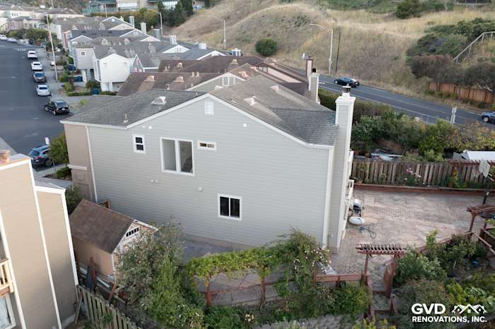Side view of a home featuring Monterey Taupe James Hardie Lap Siding and Cobble Stone trim in Daly City