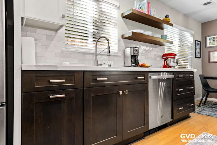 Modern kitchen with dark wood cabinets, stainless steel appliances, and open shelving in Davis, CA