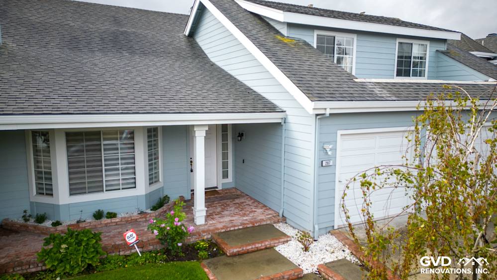 Light blue James Hardie Cedarmill siding on a home exterior with brick pathway and white trim, Foster City, CA