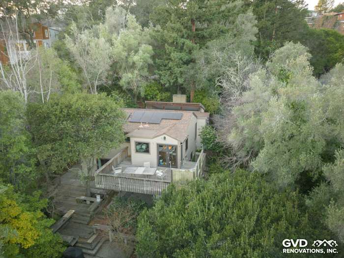 Unique Oakland home featuring James Hardie Khaki Brown siding, surrounded by lush greenery and a wooden deck