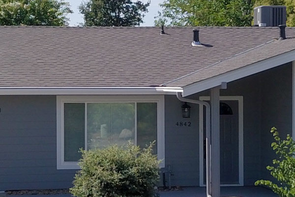 Home exterior featuring Seal Gray HardiePlank siding and Arctic White HardieTrim Boards in Rocklin, CA