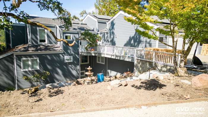 Orinda home exterior featuring James Hardie Night Gray siding and Arctic White trim with landscaped yard