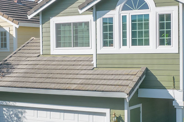 Home exterior showcasing Mountain Sage James Hardie siding and Arctic White trim in Pinole, CA
