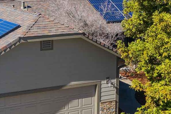 Rescue, CA home featuring James Hardie siding and Eldorado stone accents, with solar panels on the roof