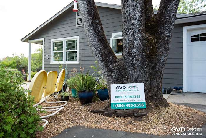 Auburn home featuring Aged Pewter HardiePlank siding with Arctic White trim and landscaping details