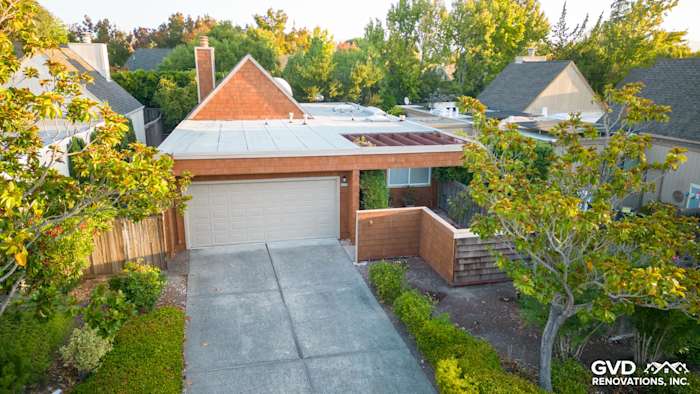 Updated home exterior featuring FTX Cedar siding, new Milgard windows, and landscaped driveway in Sonoma