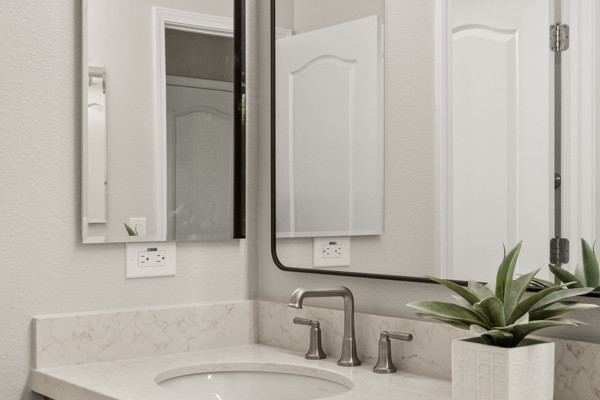 Modern hallway bathroom remodel featuring double vanity, quartz countertop, and tiled shower in El Dorado Hills