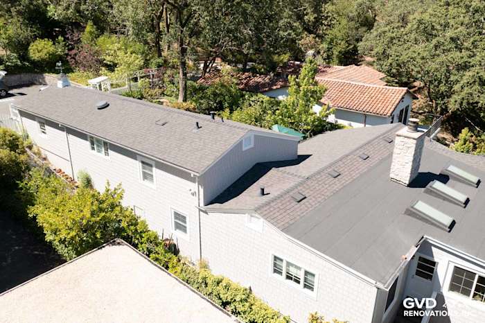 Aerial view of a home with Pearl Gray James Hardie Shingle Siding and black roofing in Orinda, CA