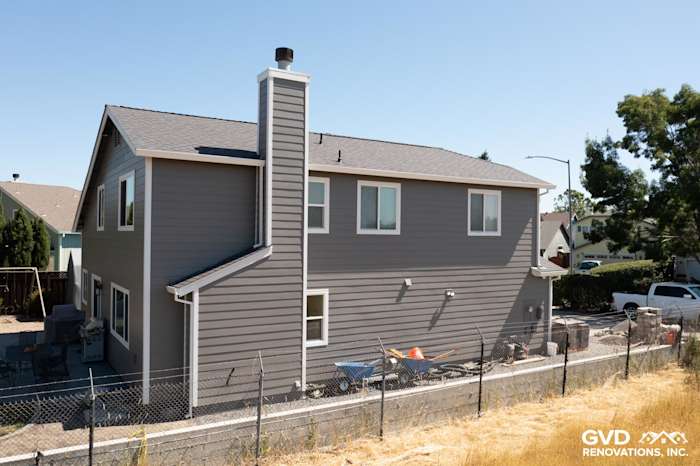Home exterior featuring James Hardie Aged Pewter siding, Arctic White trim, and a chimney in Rohnert Park