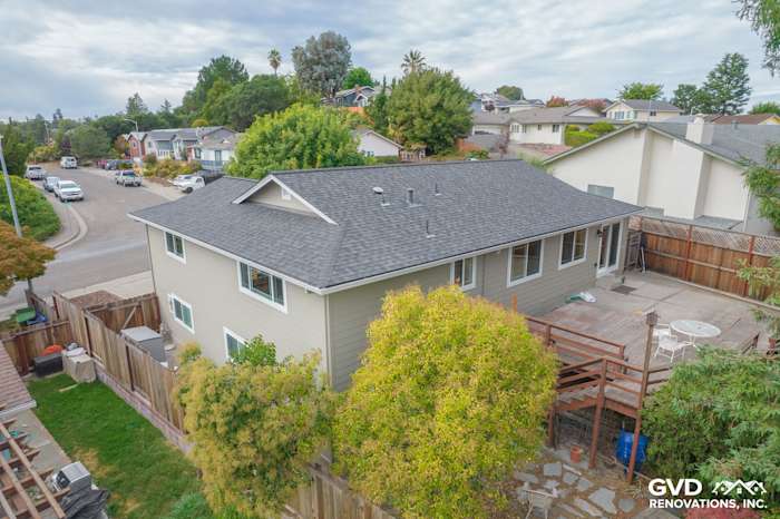 Monterey Taupe James Hardie siding and Anlin windows on a Petaluma home exterior with a fenced backyard