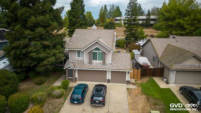 Exterior view of a transformed home featuring Craneboard Vinyl siding and new windows in Roseville, CA
