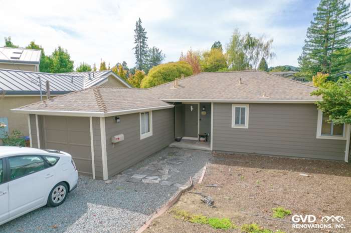 Home exterior in Mill Valley showcasing Prodigy Solid Core Siding in a sleek gray color with new roof and driveway