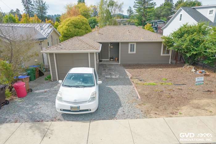 Home exterior in Mill Valley with Prodigy Solid Core Siding, gravel driveway, and newly landscaped yard
