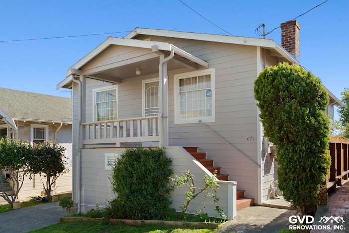 Pearl Gray James Hardie siding with Arctic White trim on a remodeled Oakland home exterior