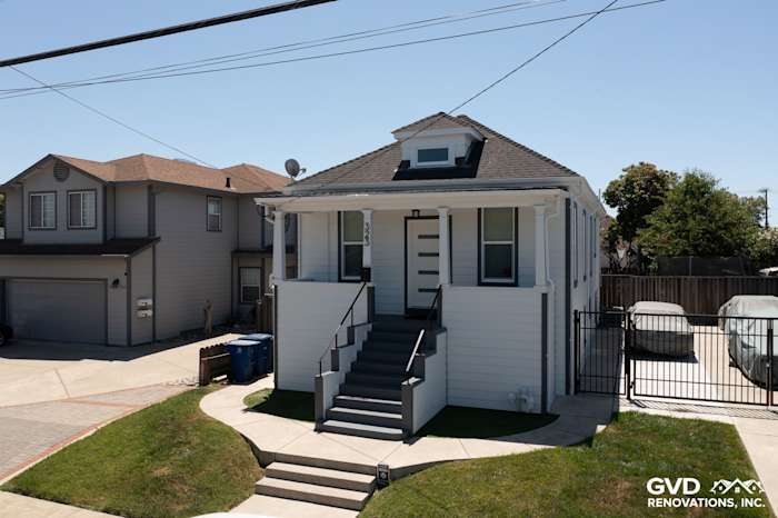 San Leandro home showcasing Arctic White James Hardie Color Plus Lap Siding and Hardie Trim with upgraded entry steps