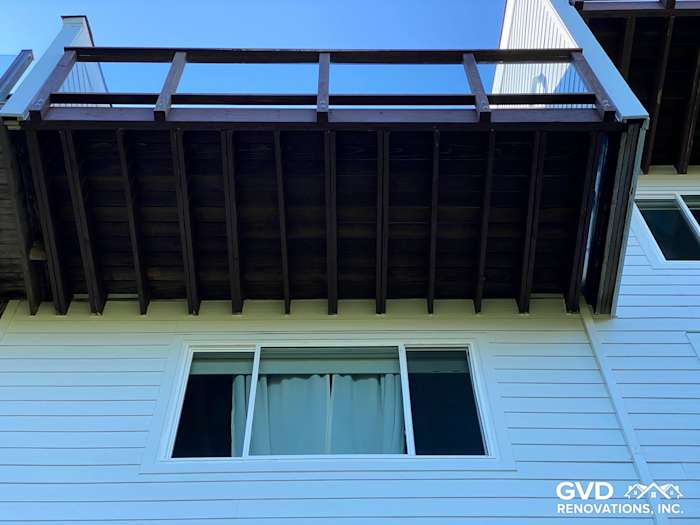 New James Hardie lap siding with a wooden deck and railings, viewed from below in Mill Valley