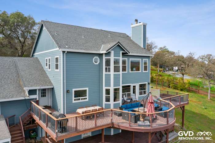 Newly installed James Hardie siding on a modern home exterior with a spacious deck in Shingle Springs