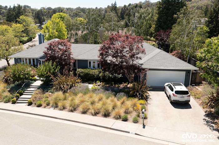 Single-story home in San Rafael featuring James Hardie Evening Blue lap siding and Arctic White trim, surrounded by