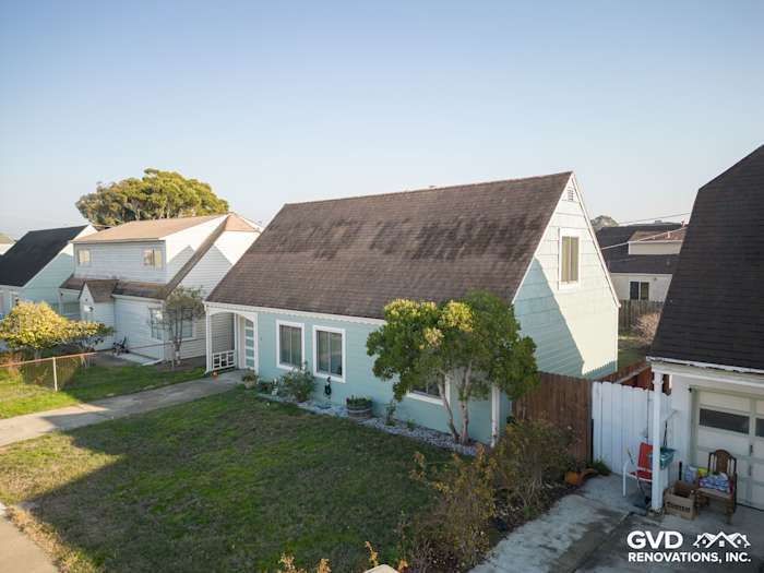 Home exterior showcasing newly installed James Hardie Artisan Lap Siding in South San Francisco, featuring a soft green color
