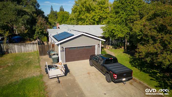 Carmichael home featuring new Alside Prodigy Vinyl Siding and Milgard Windows, with solar panels and driveway