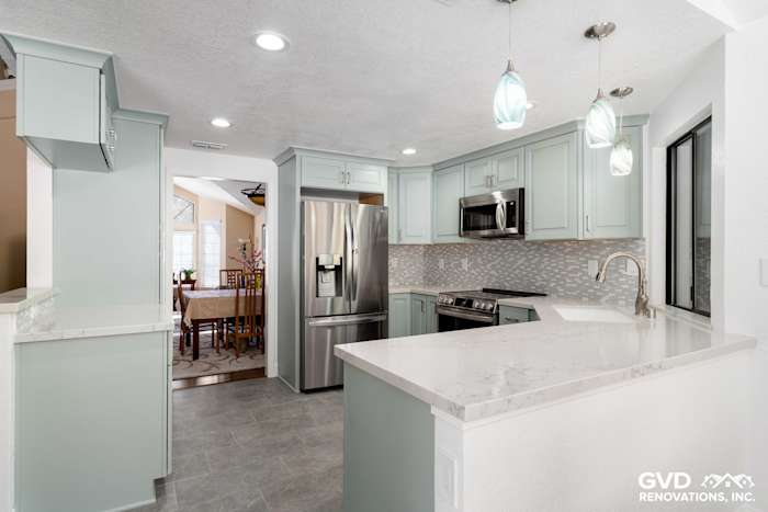 Modern kitchen remodel in Cameron Park featuring light blue cabinets, quartz countertops, stainless steel appliances