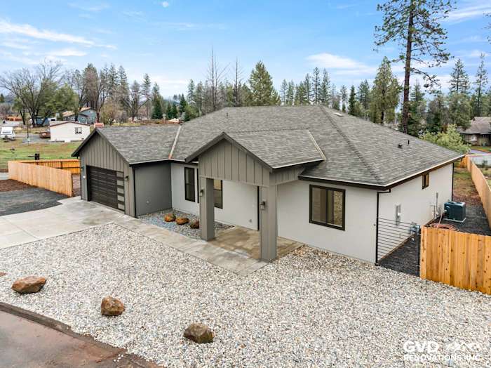 New construction home in Paradise, CA featuring James Hardie Architectural Panels in Sea Grass and Milgard windows