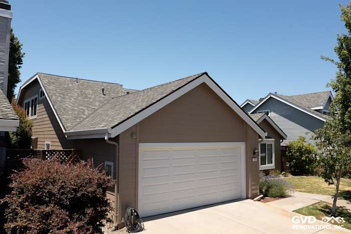 James Hardie Artisan Lap Siding in Khaki Brown with Arctic White trim on a home exterior in Foster City, CA