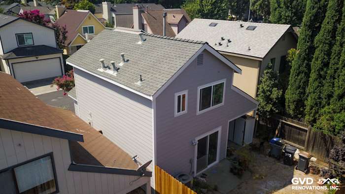 Elevated home exterior showcasing Pearl Gray HardiePlank siding and Arctic White trim in Davis, CA