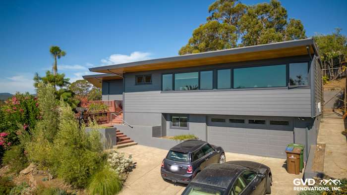 Home exterior featuring James Hardie Plank Lap Siding in Night Gray, modern design with large windows