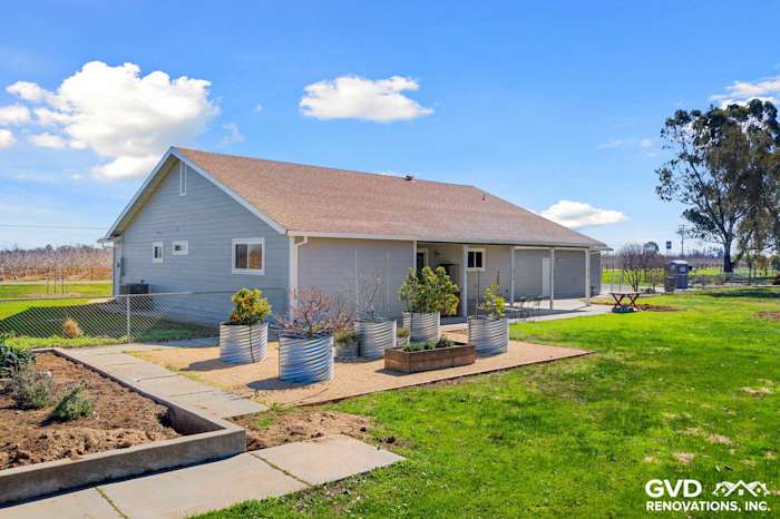 Home exterior featuring Pearl Gray James Hardie siding, Arctic White trim, and landscaped yard in Galt, CA