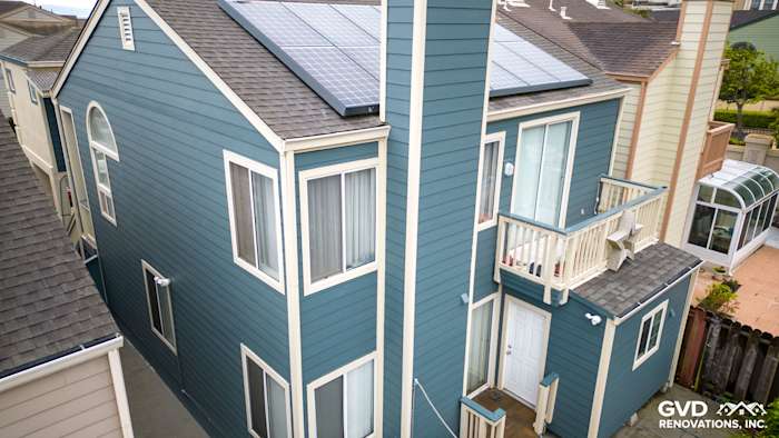 Daly City home with Evening Blue HardiePlank lap siding and solar panels on the roof