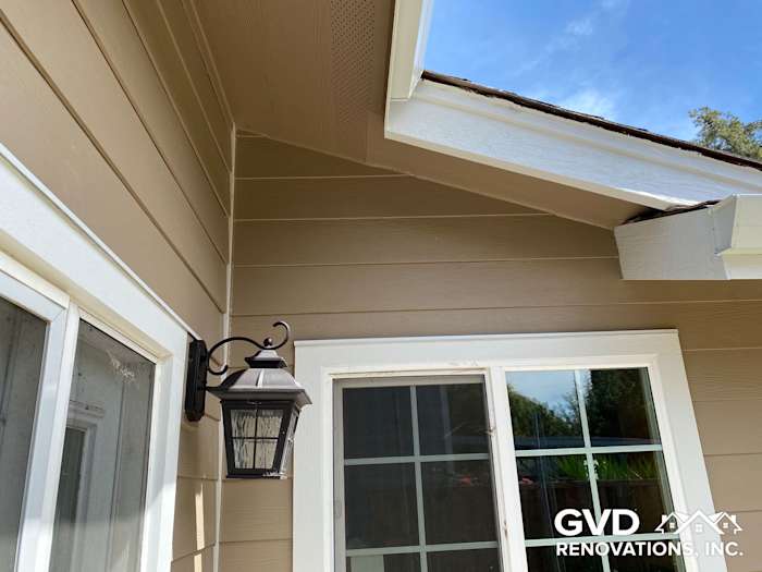 Khaki brown James Hardie lap siding with Arctic white trim and a lantern fixture, showcased in Fairfield, CA