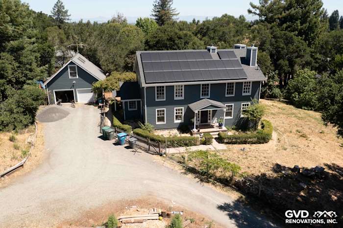 Sebastopol home featuring Evening Blue James Hardie lap siding and Arctic White trim under a clear sky