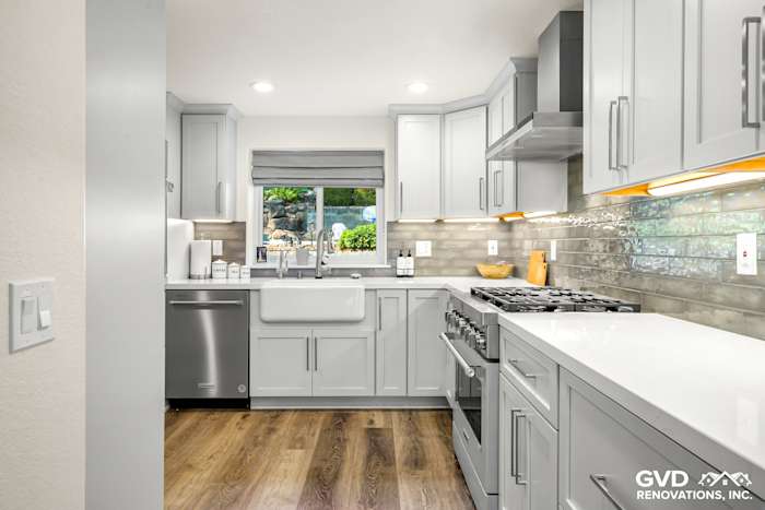 Modern kitchen remodel featuring gray cabinetry, quartz countertops, and stainless steel appliances in Rocklin, CA