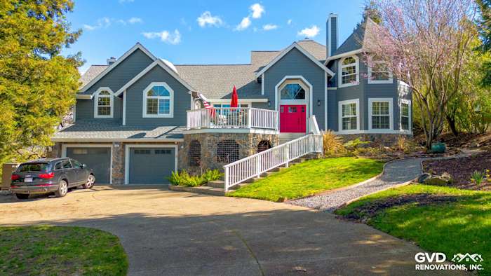 Home exterior featuring Night Gray James Hardie siding, Arctic White trim, and a bright red door in Petaluma, CA