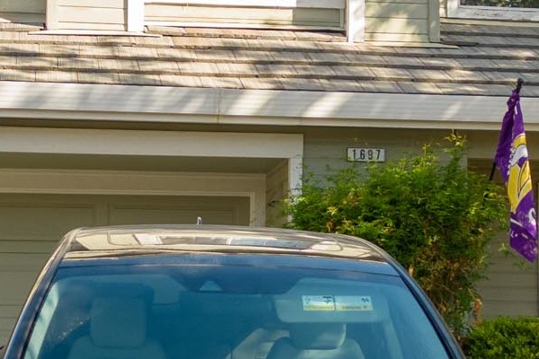 Elegant home exterior featuring James Hardie Evening Blue siding and Arctic White trim, with Milgard windows in Petaluma