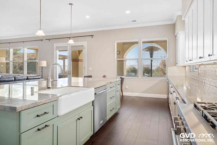 Modern kitchen with quartz countertop, farmhouse sink, and green cabinetry in El Dorado Hills