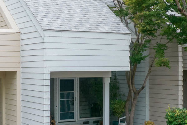 Modern quadplex featuring James Hardie siding in neutral tones, with carports and landscaped surroundings in Santa Rosa