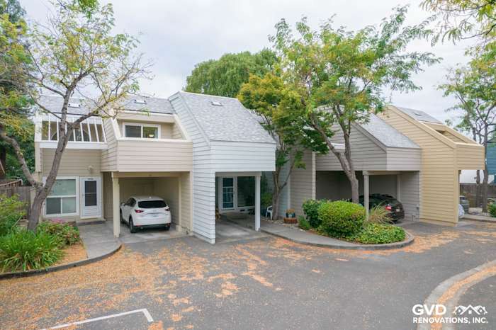 Modern quadplex featuring James Hardie siding in neutral tones, with carports and landscaped surroundings in Santa Rosa