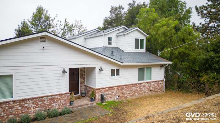 Modern Oakland home featuring James Hardie Cedarmill siding, Alside windows, and landscaped entryway