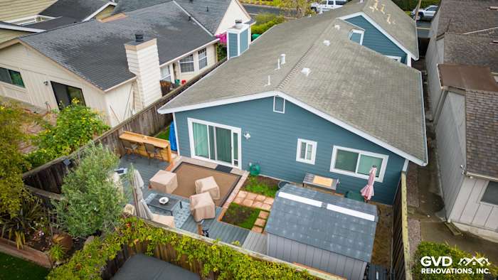 Evening Blue HardiePlank siding with Arctic White trim on a home exterior in Alameda, CA, features a landscaped yard