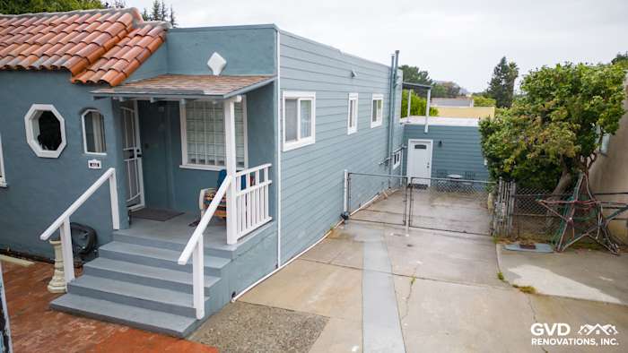 Brisbane home exterior featuring Boothbay Blue HardiePlank siding and Arctic White trim under overcast sky