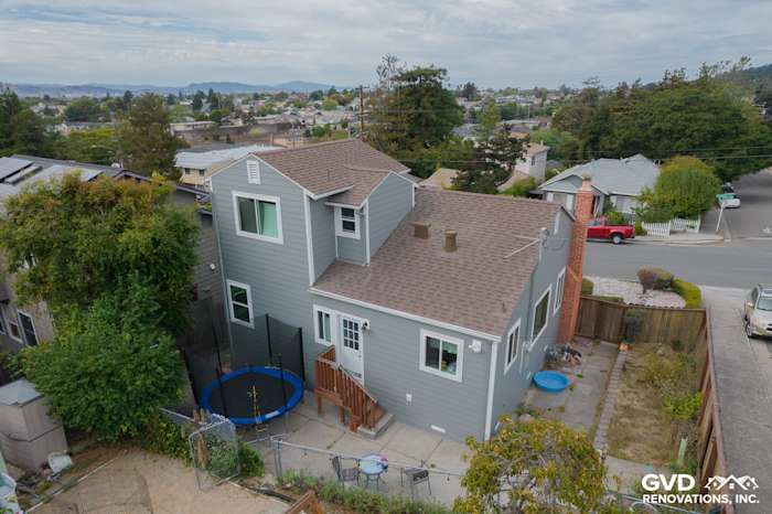 Modern home exterior featuring Gray Slate James Hardie siding, Arctic White trim, and a sloped roof in Richmond, CA
