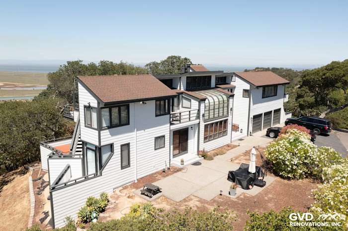 Modern home exterior in San Rafael with Arctic White James Hardie siding and a sloped roof