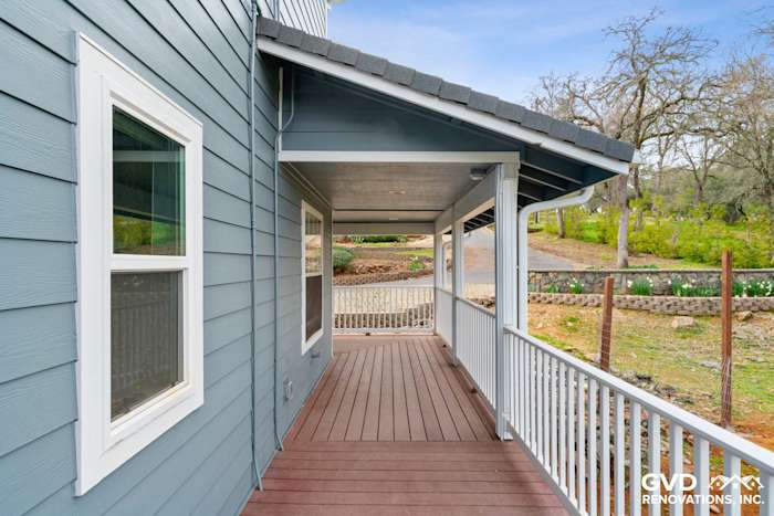 New James Hardie siding in blue on a home exterior with a wooden porch in Shingle Springs, CA