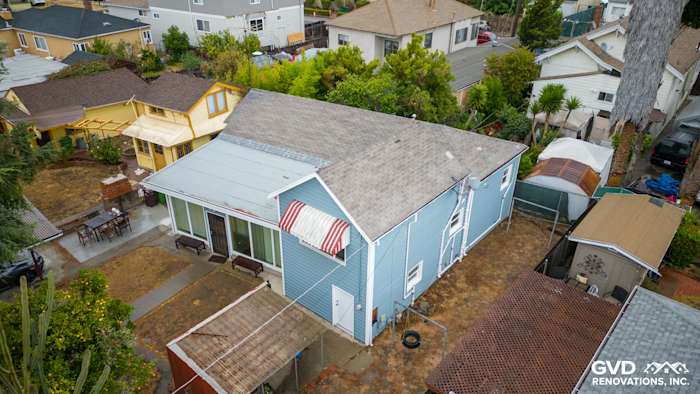 Home exterior featuring Alside Prodigy Vinyl Siding in blue, with new windows and canopy awning in Oakland, CA